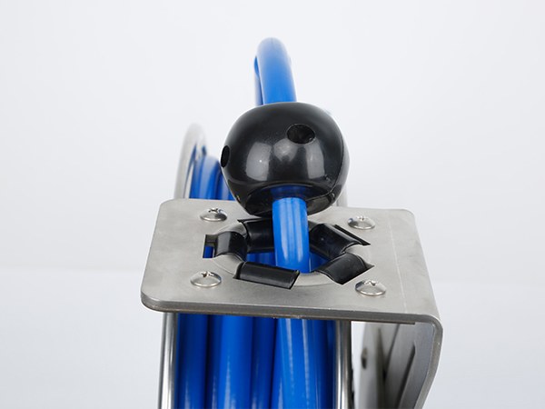 A front view of a hose reel with hose bumper.